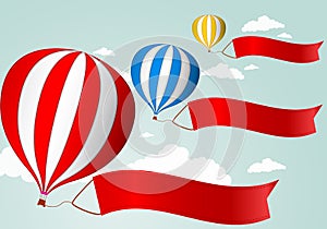 Hot air balloon in the sky .with red banner for your advertising