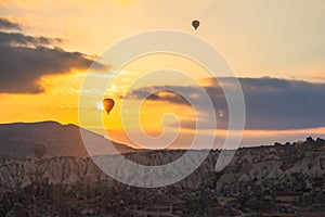 Hot air balloon at sunrise in Cappadocia, famous tourist activity