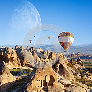 Hot air ballooning in sunrise in Cappadocia, Turkey photo