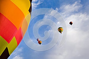 Hot Air Balloons and Blue Sky with Clouds Above New Mexico