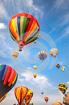 Hot-air balloons with blue sky and clouds background