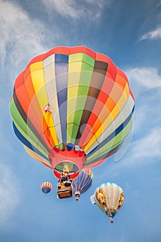 Hot-air balloons with blue sky and clouds background