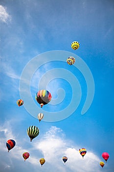 Hot-air balloons with blue sky and clouds background