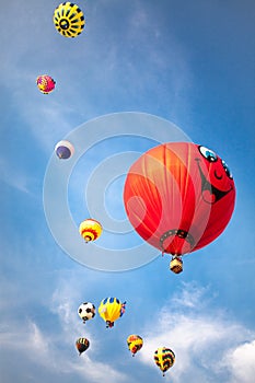 Hot-air balloons with blue sky and clouds background