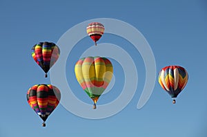 Hot Air Balloons Floating Against a Blue Sky