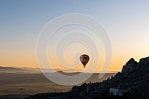 The hot air balloons flying above Goreme park, Sunrise time, Cappadocia, Turkey