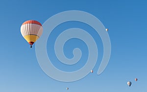 The hot air balloons flying above Goreme park, Sunrise time, Cappadocia, Turkey