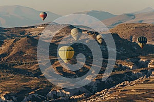 Hot air balloons flying in Goreme national park, fairy chimneys, Cappadocia, Turkey