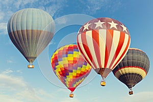 Hot air balloons flying over blue sky photo