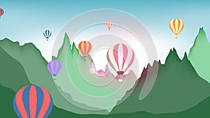 Hot air balloons flying over mountains
