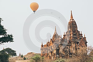 Hot air balloons flying over pagodas at Bagan temple complex, Myanmar