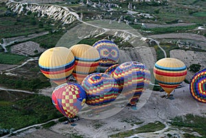 Hot air balloons are inflated prior to takeoff at Goreme in Turkey.