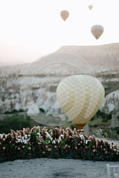 Hot air balloons landing in a mountain Cappadocia Goreme National Park Turkey
