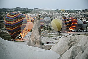 Hot air balloons landing in a mountain Cappadocia Goreme National Park Turkey