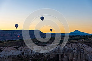 Hot Air Balloons Over Love Valley in Cappadocia, Turkey at Dawn