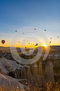 Hot Air Balloons Over Love Valley in Cappadocia, Turkey at Dawn