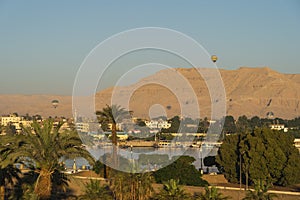 Hot air balloons over Luxor city and Nile river in a beautiful morning sunrise, Upper Egypt