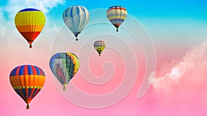 Hot air balloons over the soft cloud background on the sky with