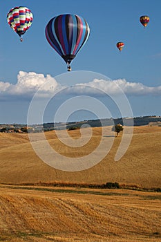 Hot-air Balloons over Tuscan Landscape