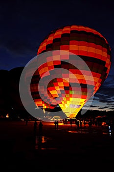 Hot air balloons are preparing to take off in Cappadocia early in the morning