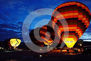 Hot air balloons are preparing to take off in Cappadocia early in the morning