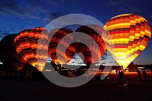 Hot air balloons are preparing to take off in Cappadocia early in the morning photo