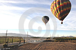 Hot Air Balloons Soaring over roadways