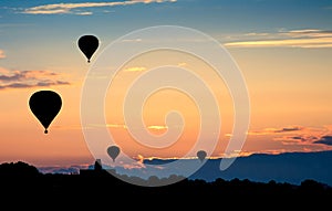 Hot air balloons on sunset. Beautiful nature background.