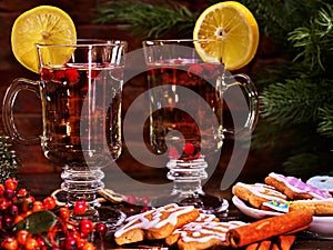 Hot alcohol wine and Christmas cookie with canella stick