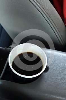 Hot Americano coffee in take away cup in car
