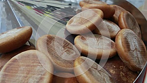 Hot baked bread loafs on the production line