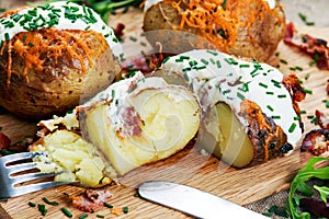 Hot Baked Potato with cheese, bacon, chives and sour cream.