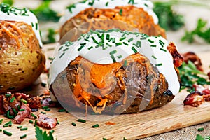 Hot Baked Potato with cheese, bacon, chives and sour cream.