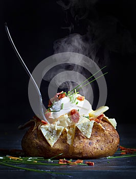Hot Baked Potato with Sour Cream and Toppings