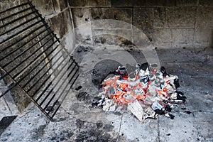 Hot barbecue iron grill and glowing charcoal