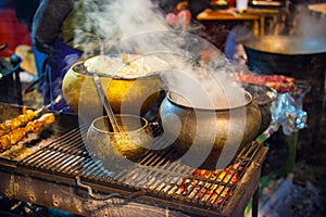 Hot barbeque food on a Christmas fair