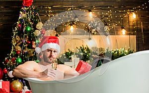 Hot bath health benefits. Santa Claus luxuriate in warm bath. Take delight. Pampering myself. Winter holidays. New year