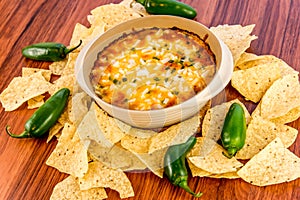 Hot bean dip with jalapenos, sour cream and melted cheddar chees
