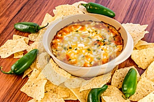 Hot bean dip with jalapenos, sour cream and melted cheddar chees