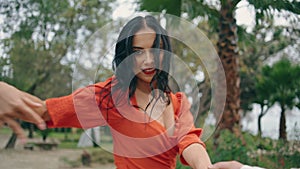 Hot beautiful woman dancer performing energetic dance in green city park closeup