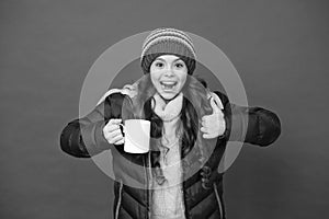 Hot beverage. Idea for warming. Happy girl hipster. Child warm knitwear. Green tea no sugar. Baby tea cup. Have warming