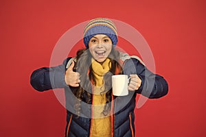 Hot beverage. Idea for warming. Happy girl hipster. Child warm knitwear. Green tea no sugar. Baby tea cup. Have warming