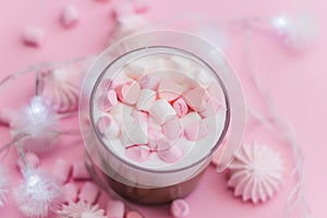 Hot beverage with whipped cream,marshmallows and heart shaped chocolate candies