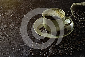 Hot black coffee for morning beverage menu in vintage brown ceramic cup with coffee beans roasted