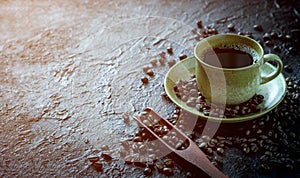 Hot black coffee for morning beverage menu in vintage brown ceramic cup with coffee beans roasted