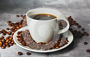 Hot black coffee for morning beverage menu in white ceramic cup with coffee beans. photo