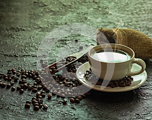 Hot black coffee with smoke for morning beverage menu in vintage brown ceramic cup with coffee beans roasted