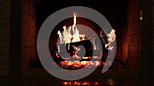Hot burning wood and coals in the home fireplace, contains the sound of burning wood