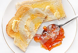Hot buttered toast and marmalade