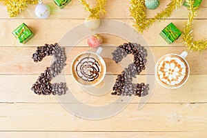 Hot cappuccino with coffee bean in 2020 year sign